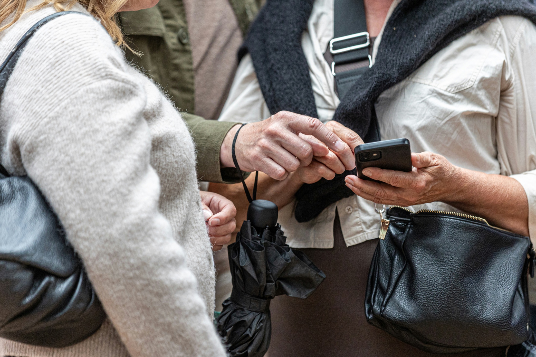 Two people sharing a phone screen together